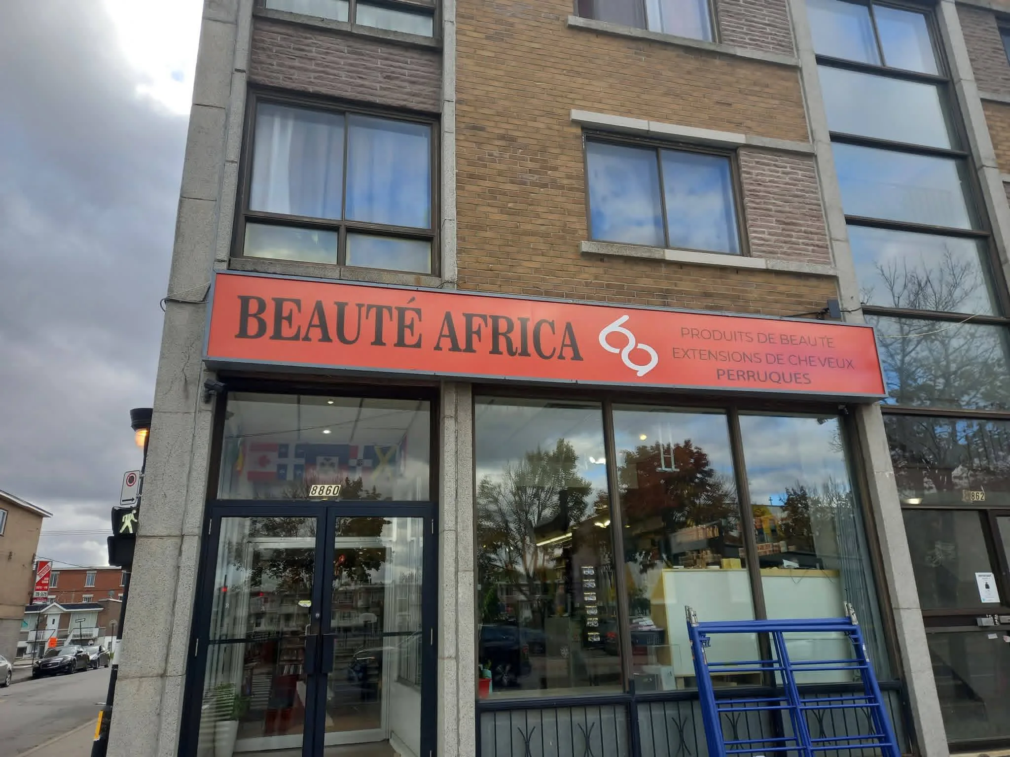 Illuminated sign box mounted at height using Max Printing bucket truck — Greater Montreal